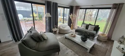 Coin salon dans l'établissement Maison 10 personnes 24h du Mans