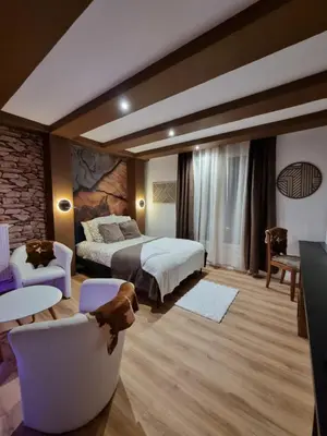 Un ou plusieurs lits dans un hébergement de l'établissement Esprit Chalet en centre ville Confort et charme
