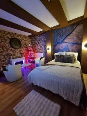 Un ou plusieurs lits dans un hébergement de l'établissement Esprit Chalet en centre ville Confort et charme