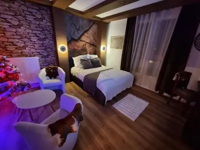 Un ou plusieurs lits dans un hébergement de l'établissement Esprit Chalet en centre ville Confort et charme