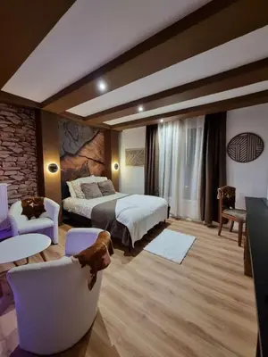 Un ou plusieurs lits dans un hébergement de l'établissement Esprit Chalet en centre ville Confort et charme