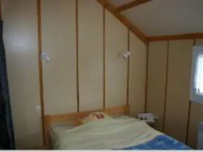 Un ou plusieurs lits dans un hébergement de l'établissement Chalet avec terrasse - 7 pers. - API-1-52-958