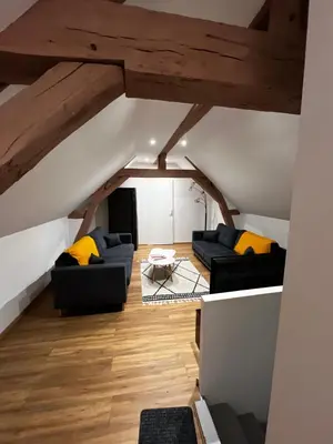 Coin salon dans l'établissement Cozy loft between zoo and castles