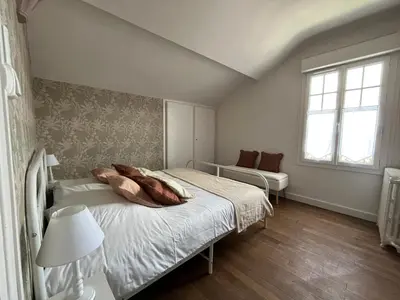 Un ou plusieurs lits dans un hébergement de l'établissement Maison WILSON