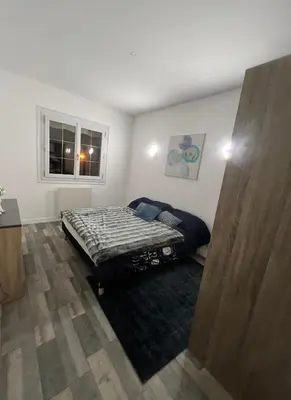Un ou plusieurs lits dans un hébergement de l'établissement Maison chaleureuse Amboise