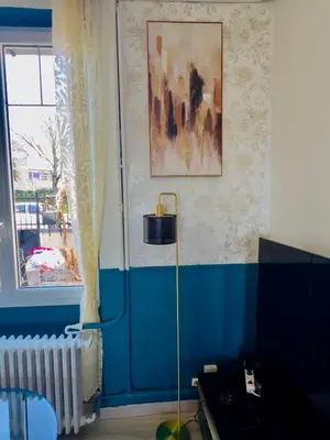 Coin salon dans l'établissement Maison Cosy avec Véranda vue sur la Loire, jardin et parking gratuit
