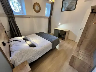 Un ou plusieurs lits dans un hébergement de l'établissement Appartement spacieux & familial, climatisation, hypercentre de Tours, le Belvédère