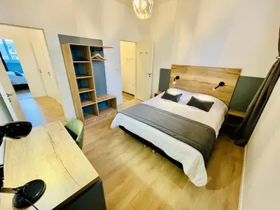 Un ou plusieurs lits dans un hébergement de l'établissement Appartement spacieux & familial, climatisation, hypercentre de Tours, le Belvédère