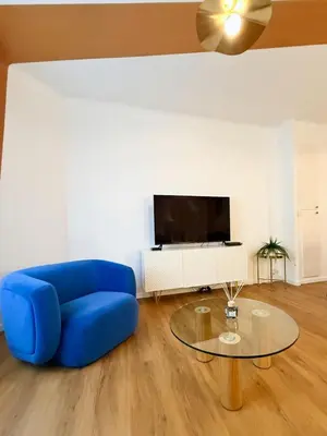 Télévision ou salle de divertissement dans l'établissement L'Escapade Bleue