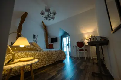 Un ou plusieurs lits dans un hébergement de l'établissement Chouette Nuit