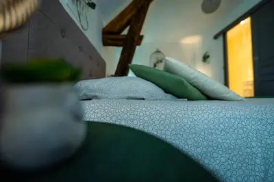 Un ou plusieurs lits dans un hébergement de l'établissement Chouette Nuit