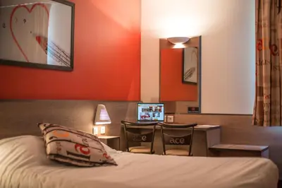 Un ou plusieurs lits dans un hébergement de l'établissement Ace Hôtel Angers