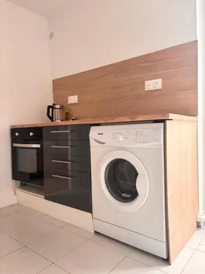 Cuisine ou kitchenette dans l'établissement Appartement calme en centre ville