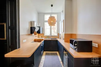 Cuisine ou kitchenette dans l'établissement Spacieux Appartement - Type Haussmannien - Wifi