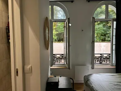 Un ou plusieurs lits dans un hébergement de l'établissement L'Appartement Buffon - Coeur de Tours