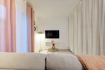 Télévision ou salle de divertissement dans l'établissement Le Sésame