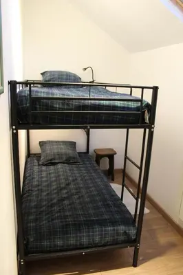 Un ou plusieurs lits dans un hébergement de l'établissement Charmante maison à la campagne