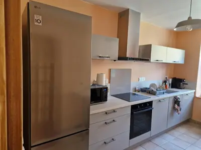 Cuisine ou kitchenette dans l'établissement Maison Le Thuau