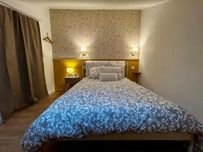 Un ou plusieurs lits dans un hébergement de l'établissement Cosy 24 - Le Mans City Center