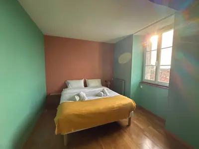 Un ou plusieurs lits dans un hébergement de l'établissement Bois Sangha Maison 3 chambre avec jardin clos
