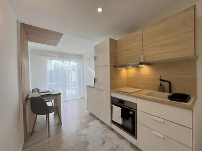 Cuisine ou kitchenette dans l'établissement La Petite Mancelle - Hôpital du Mans