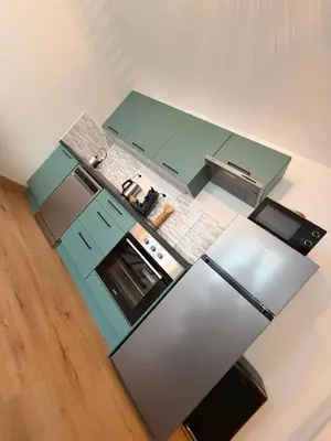 Cuisine ou kitchenette dans l'établissement Appartement cosy au cœur du Mans Proche Centre-Ville