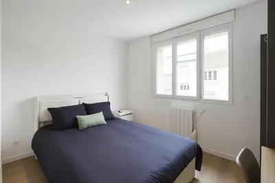 Un ou plusieurs lits dans un hébergement de l'établissement House with 9 Private Suites near Le Mans Circuit