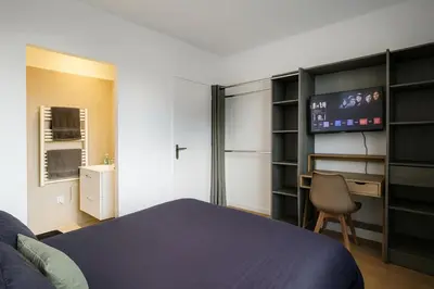 Un ou plusieurs lits dans un hébergement de l'établissement House with 9 Private Suites near Le Mans Circuit