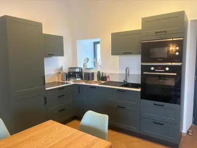 Cuisine ou kitchenette dans l'établissement Grange rustique rénovée au cœur de la campagne sarthoise - FR-1-410-489