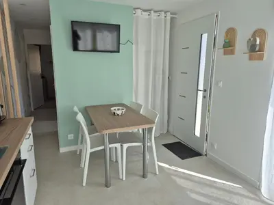 Télévision ou salle de divertissement dans l'établissement Le cocoon idyllique