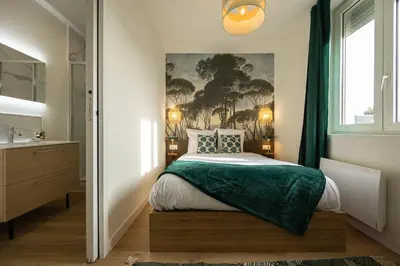 Un ou plusieurs lits dans un hébergement de l'établissement 302 Chanzy - Jungle Chic - T1 Dépaysant - Centre