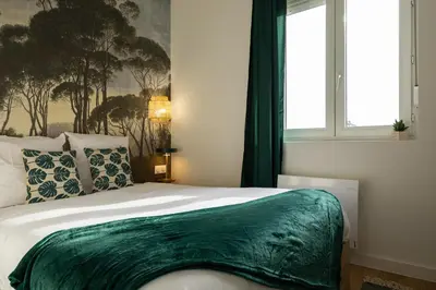Un ou plusieurs lits dans un hébergement de l'établissement 302 Chanzy - Jungle Chic - T1 Dépaysant - Centre