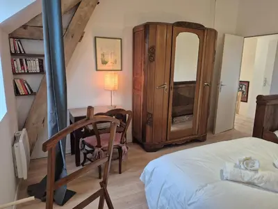 Un ou plusieurs lits dans un hébergement de l'établissement Maison de la Croix Verte - Gite 13 personnes a Chambourg