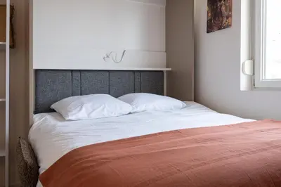 Un ou plusieurs lits dans un hébergement de l'établissement 305 Chanzy - Ethnique Chic - Studio Premium - Wifi
