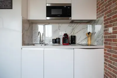 Cuisine ou kitchenette dans l'établissement 307 Chanzy - Industriel - Studio Design - Centre
