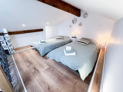 Un ou plusieurs lits dans un hébergement de l'établissement La Maisonnette de Carreaux