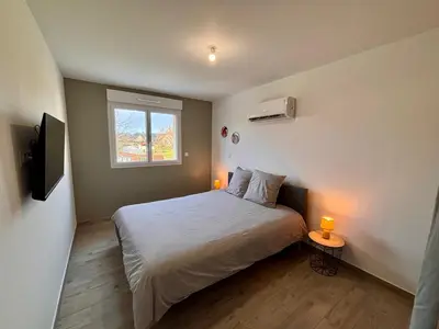 Un ou plusieurs lits dans un hébergement de l'établissement Maison Verde - Maison moderne cozy avec extérieur