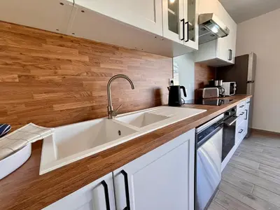 Cuisine ou kitchenette dans l'établissement Maison Mocca - Maison moderne cozy avec extérieur