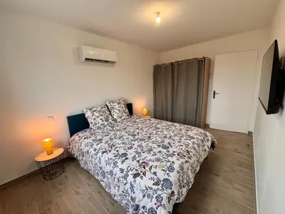 Un ou plusieurs lits dans un hébergement de l'établissement Maison Mocca - Maison moderne cozy avec extérieur