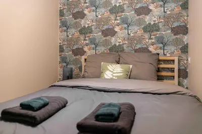 Un ou plusieurs lits dans un hébergement de l'établissement Murmures Cactus, Spa & Sauna à Blois