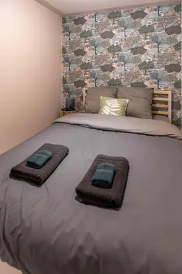 Un ou plusieurs lits dans un hébergement de l'établissement Murmures Cactus, Spa & Sauna à Blois