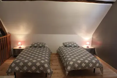 Un ou plusieurs lits dans un hébergement de l'établissement Gîte 5 personnes au calme avec jardin, piscine, proche d'Amboise