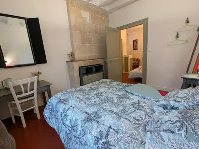 Un ou plusieurs lits dans un hébergement de l'établissement Le Tintamarre - Chambres et suite familiale à 5 min du Zoo de Beauval