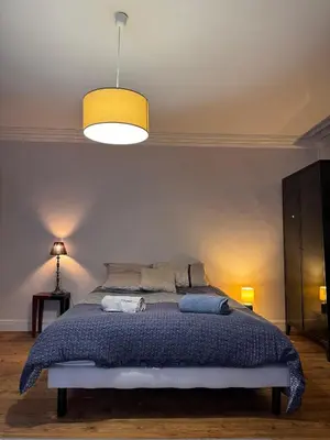 Un ou plusieurs lits dans un hébergement de l'établissement Maison de charme centrale & jardin - 24h du Mans