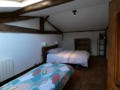 Un ou plusieurs lits dans un hébergement de l'établissement Gîte Val de Loire Le Puits