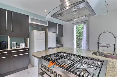 Cuisine ou kitchenette dans l'établissement La Tuilerie - Maison familiale