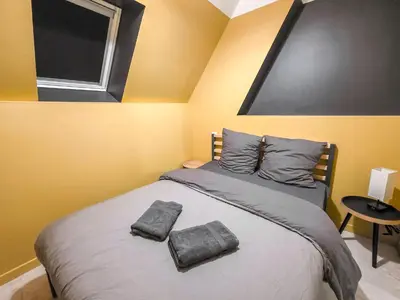 Un ou plusieurs lits dans un hébergement de l'établissement Le Cocon Massant - Cosy & Détente Absolue