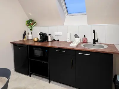 Cuisine ou kitchenette dans l'établissement Le Lodge Corail - Massage Réparateur & Design Fun