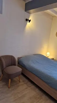 Un ou plusieurs lits dans un hébergement de l'établissement Le petit quai # Studio # site historique