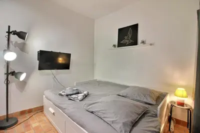 Un ou plusieurs lits dans un hébergement de l'établissement Le Colbert calme WIFI Hypercentre